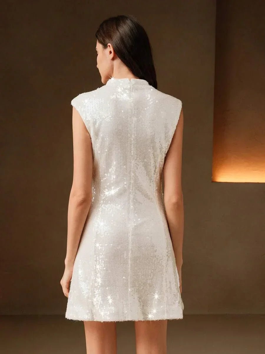 This elegant sleeveless dress features a stunning white sequin design that radiates a soft shimmer, perfect for any special.