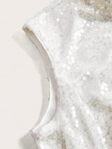 This elegant white dress features a stunning sequin overlay that catches the light beautifully, perfect for special.