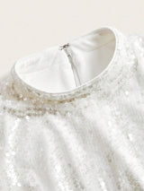 This elegant white dress features a sparkling sequin embellishment that adds a touch of glam, perfect for special occasions..