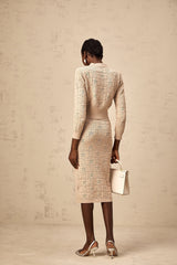 Khaki colored matching set featuring a crochet knit cardigan and skirt with star pattern details