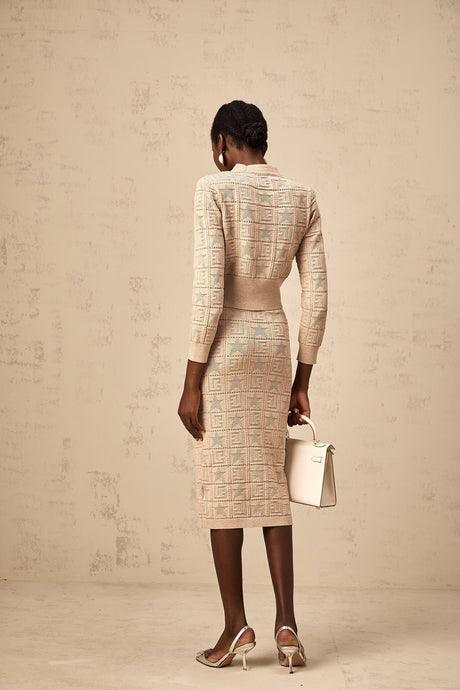 Khaki colored matching set featuring a crochet knit cardigan and skirt with star pattern details