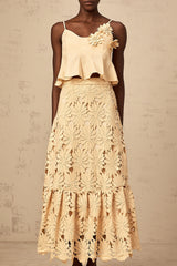Khaki colored matching set with a flared top and skirt featuring cutout details