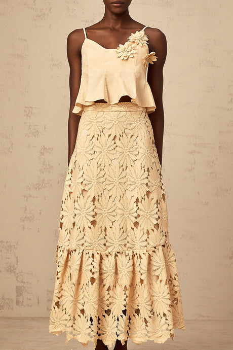 Khaki colored matching set with a flared top and skirt featuring cutout details