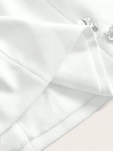 This elegant white dress features a tailored fit with delicate pleating and subtle detailing that adds a touch of.