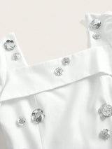 This elegant white dress features a flattering fit with delicate floral embellishments that add a touch of sparkle and.