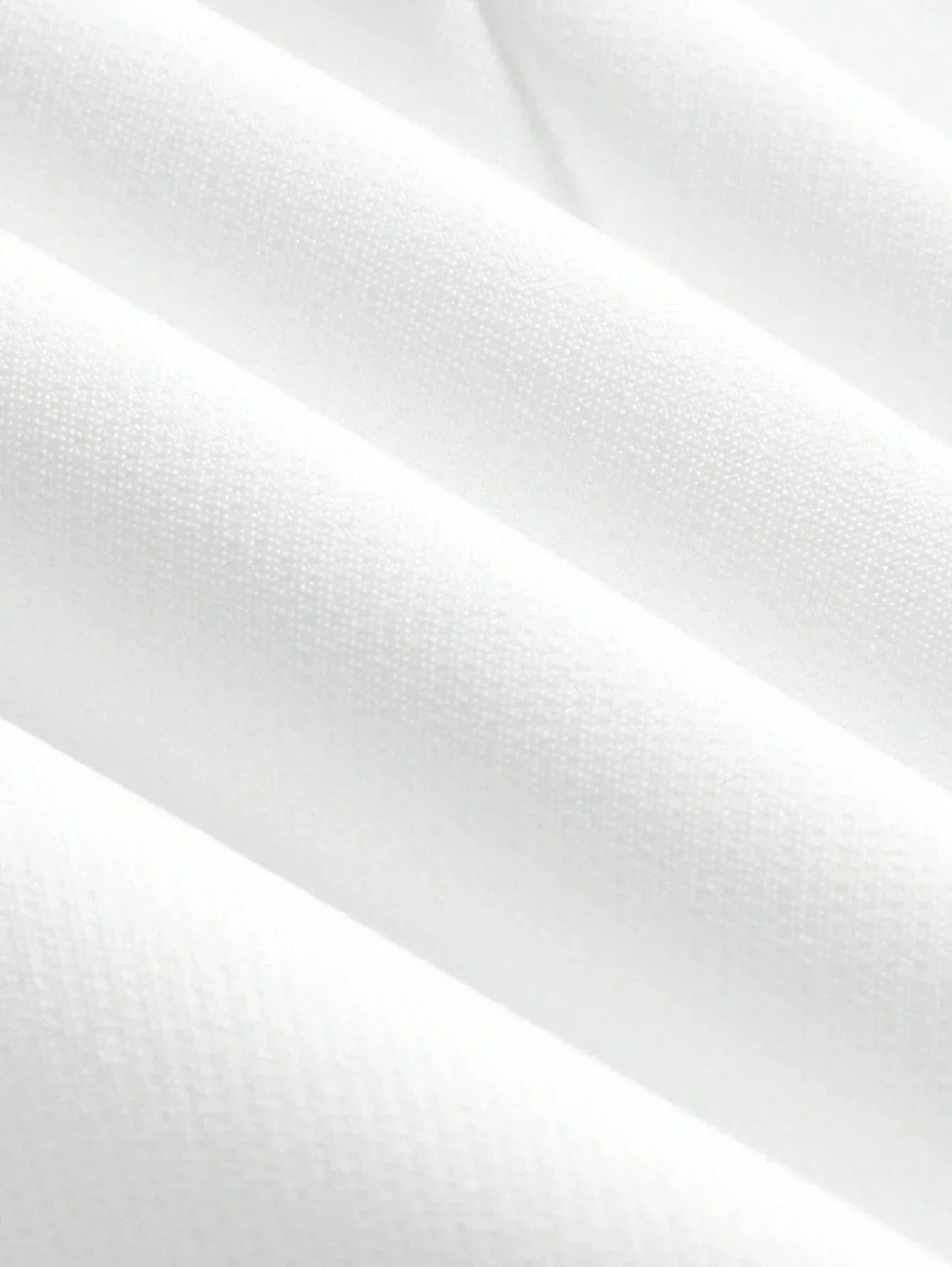 Soft and lightweight white fabric showcases a refined texture with a subtle sheen, perfect for a fresh, elegant dress. This.