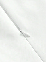This elegant white dress features a sleek, fitted silhouette and a zipper closure for added convenience, showcasing a.