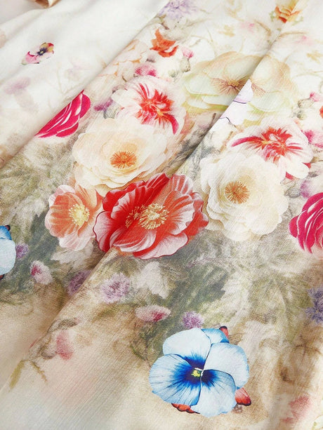 This flowing dress features a delicate, pastel floral print with vibrant hues of red, pink, and blue, creating an enchanting.