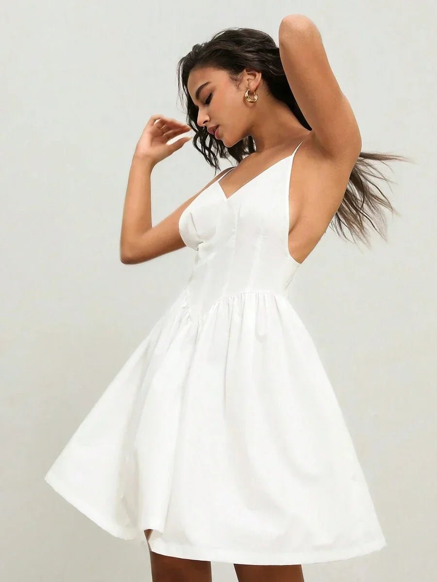 This elegant white dress features a flattering A-line silhouette with a playful skater skirt that flares out beautifully..