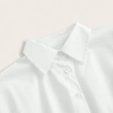 This crisp white dress shirt features a classic collar and button-down front, crafted from smooth, breathable cotton for a.