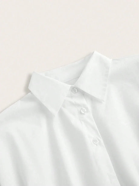 This elegant white dress shirt features a classic collared design, crafted from soft, breathable cotton for all-day comfort..