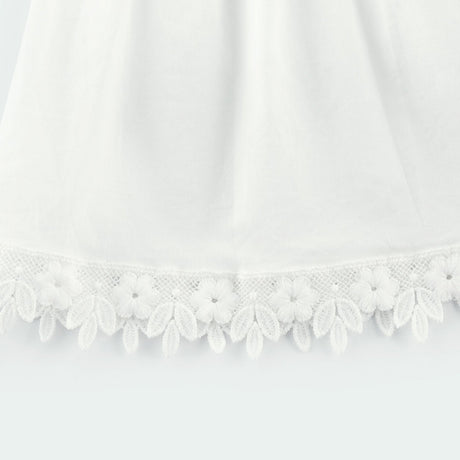 Light colored lace midi dress with floral embroidery details and feminine silhouette