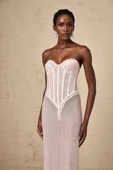 Long pink maxi dress with sheer fabric and rhinestone embellishments