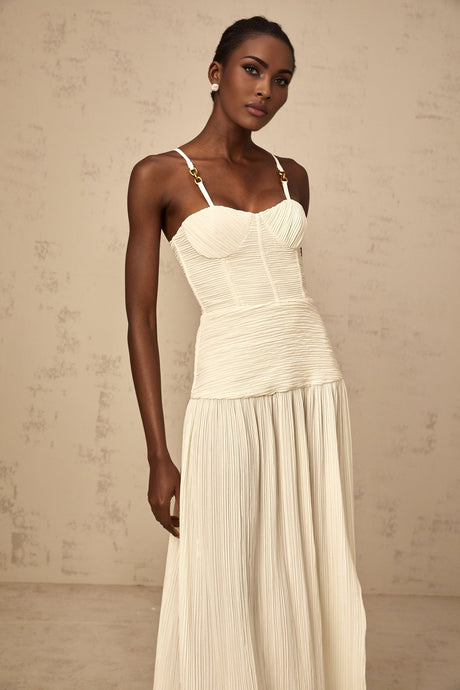 Long pleated maxi dress with side slit in neutral color tones