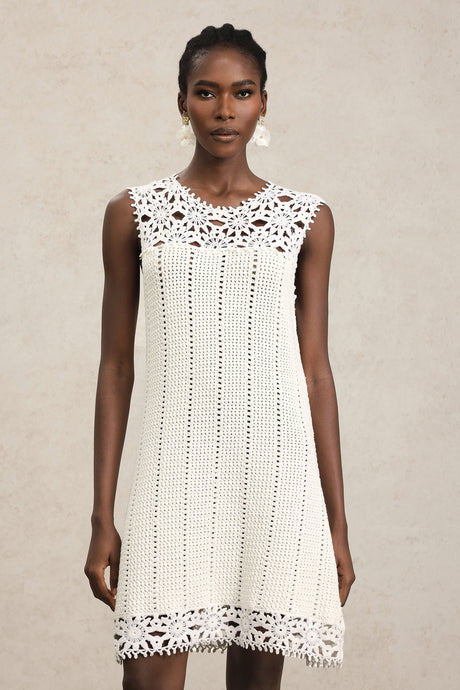 Luigia White Lace Sleeveless Mini Dress with Floral Patterns and Playful Hemline