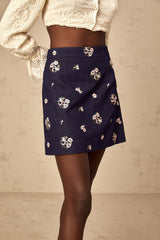Lylou mini skirt in blue with delicate flower embroidery detail along the hem