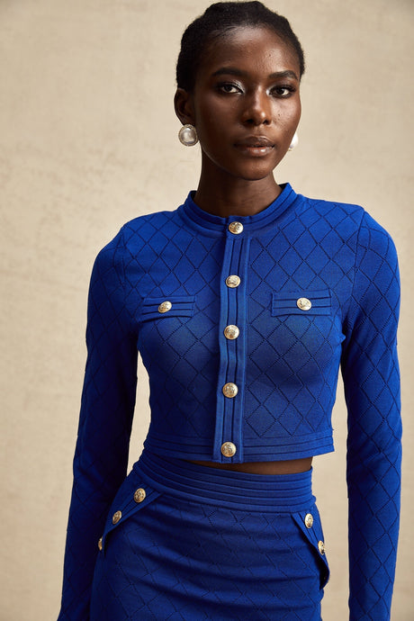 Maelys blue knitted matching set with top and skirt featuring button details