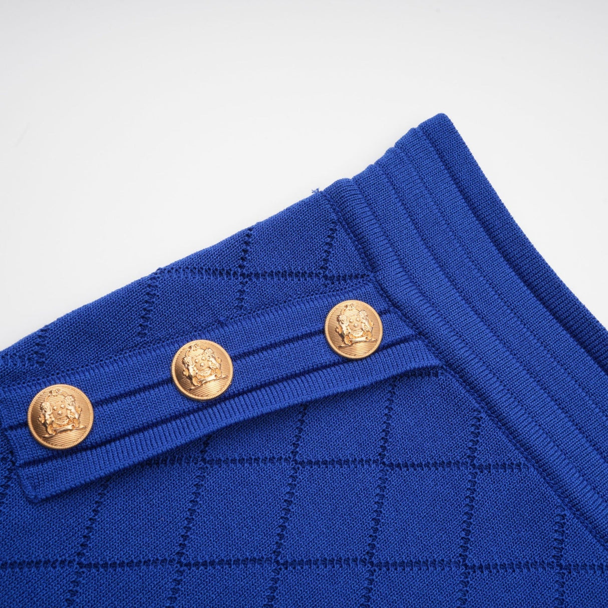 Maelys blue knitted top and skirt set with button details on both pieces
