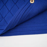 Maelys matching blue knitted set featuring a top with button details and a skirt