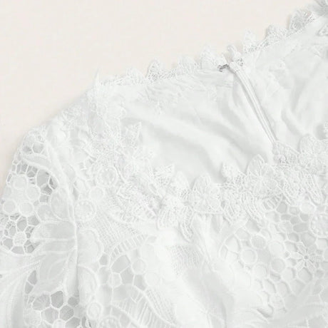 Delicate and ethereal, this white lace dress features intricate floral embroidery and a flattering fit that enhances the.