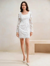 This elegant white lace dress features a fitted silhouette, long sleeves, and a delicate scalloped neckline that adds a.