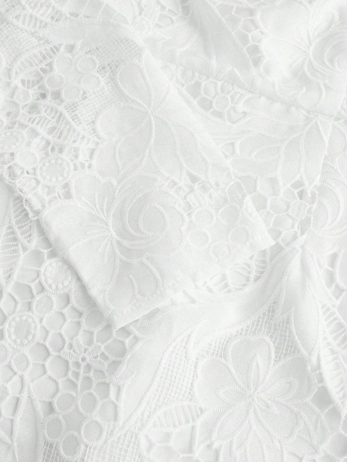 Delicate and elegant, this white lace dress features intricate floral patterns and a soft, flowing silhouette that enhances.