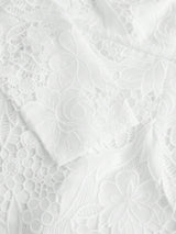 Delicate and elegant, this white lace dress features intricate floral patterns and a soft, flowing silhouette that enhances.