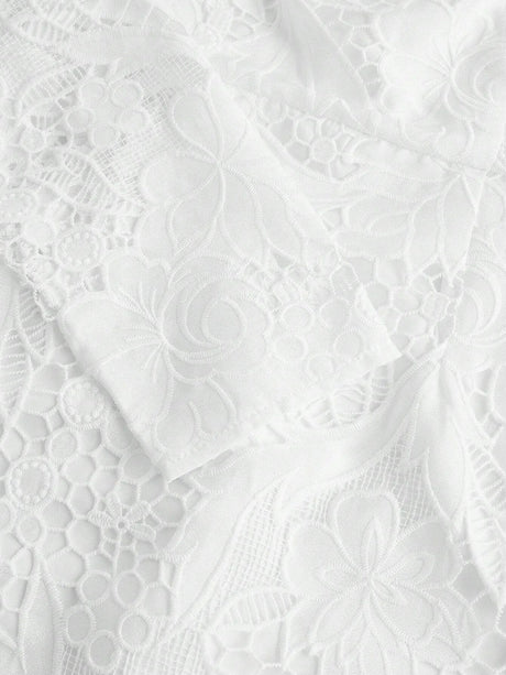 Delicate and elegant, this white lace dress features intricate floral patterns and a soft, flowing silhouette that enhances.