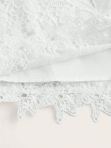 Delicate and enchanting, this white lace dress features intricate floral patterns and a soft, flowing silhouette. Crafted.