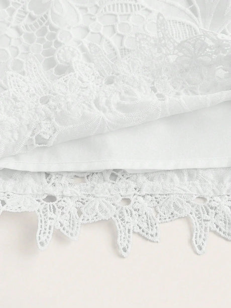 Delicate and enchanting, this white lace dress features intricate floral patterns and a soft, flowing silhouette. Crafted.