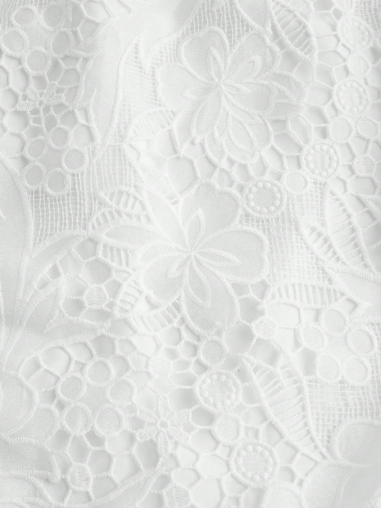 Delicate and elegant, this white lace dress features a beautifully intricate floral pattern that adds a touch of romance..