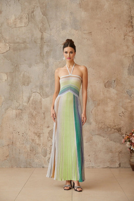 Metallic gold knit maxi dress with open back design and floor length skirt