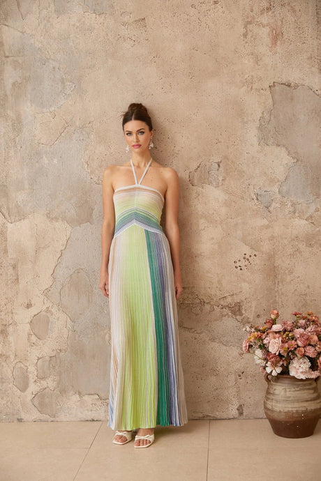 Metallic knit maxi dress with backless design in shimmering fabric floor length and form fitting silhouette
