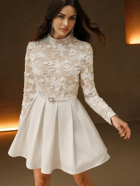 Charming and elegant, this white dress features a fitted bodice adorned with intricate floral lace detailing and long.