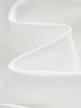 This elegant white dress features a flowing silhouette crafted from soft, lightweight fabric that drapes beautifully. Its.