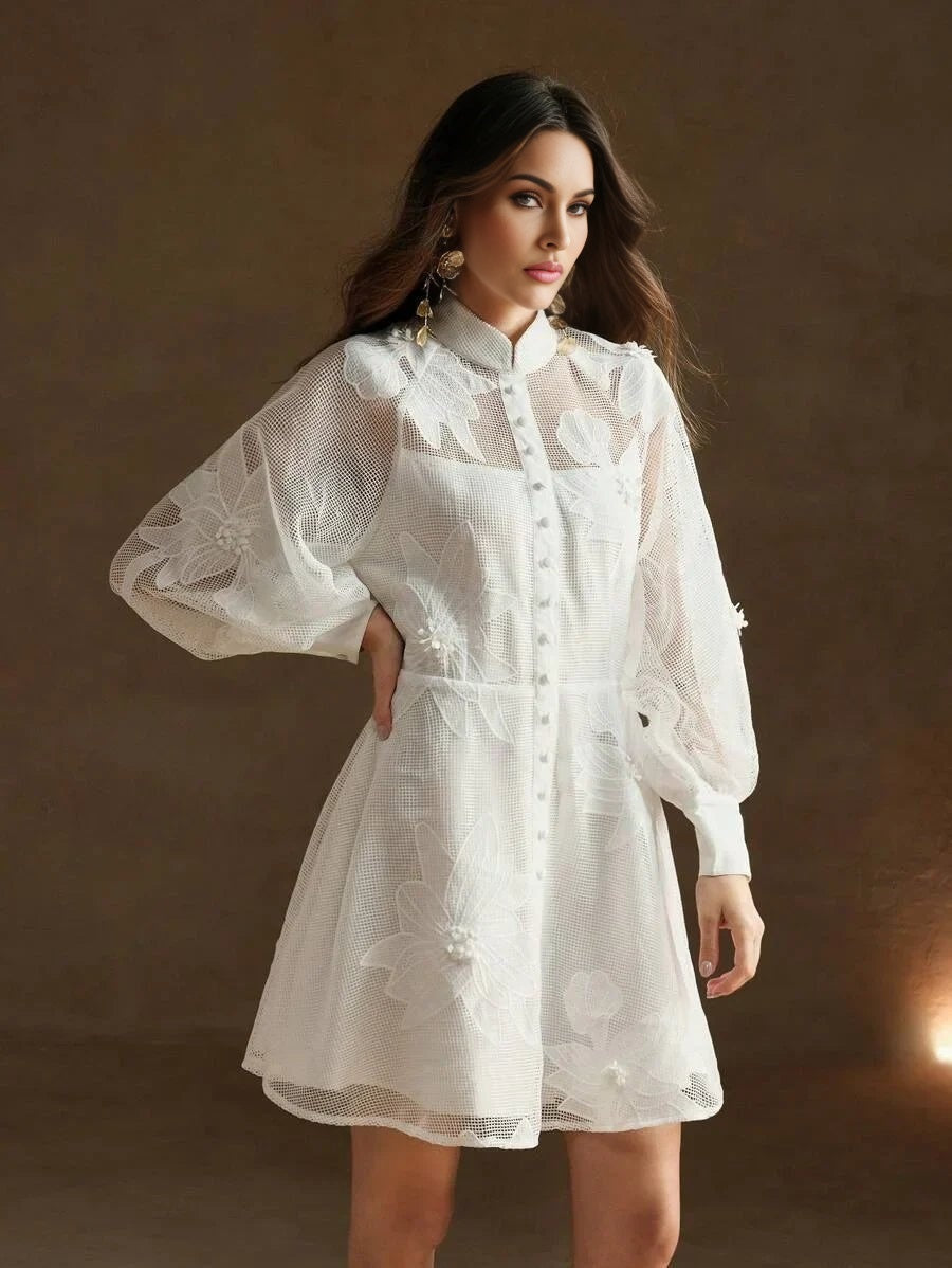 This enchanting white dress features intricate floral embroidery and a flattering fit-and-flare silhouette, perfect for any.