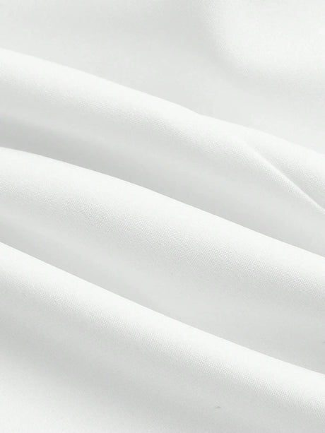 Delicate white fabric drapes gracefully, showcasing a smooth and luxurious texture that is soft to the touch. This versatile.