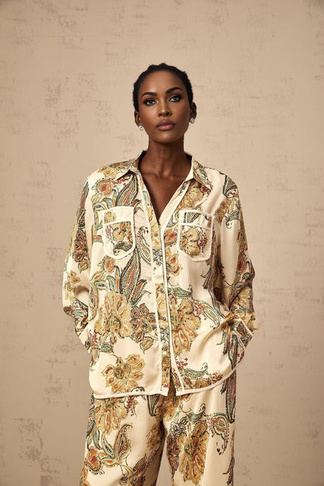 Neutral colored matching set with floral print shirt and trousers featuring an Agnès design