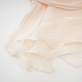 Neutral colored short dress with full pleats and ruffle details Eugenie mini dress