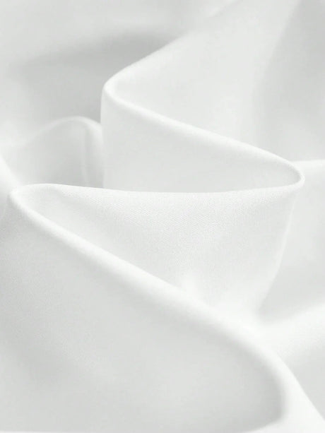 Experience elegance with this flowing white dress, crafted from a soft, lightweight fabric that drapes beautifully for a.