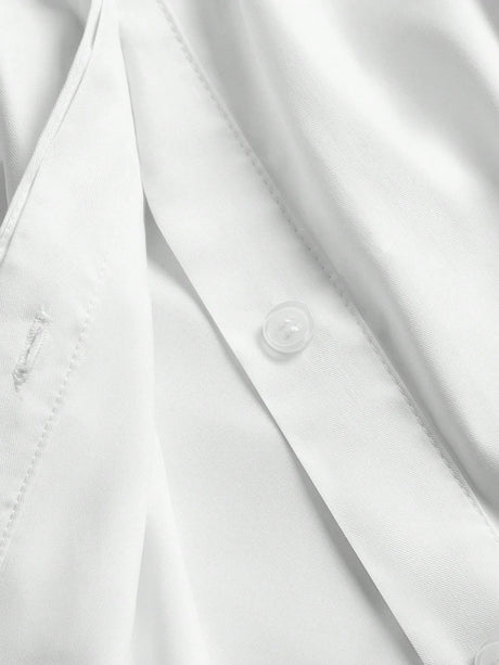 This elegant white dress features a sleek button-up design, showcasing a refined and polished look perfect for various.