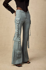 Olive green flared cargo trousers with belt loops and multiple pockets on the legs