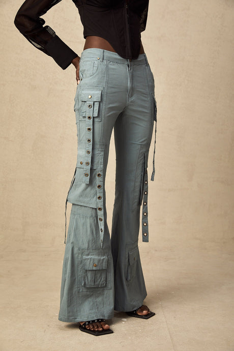 Olive green flared cargo trousers with belt loops and multiple pockets on the legs