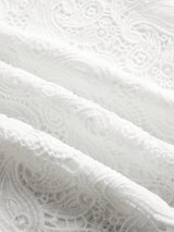 Delicate and elegant, this white lace fabric features intricate patterns that evoke a sense of timeless sophistication. The.