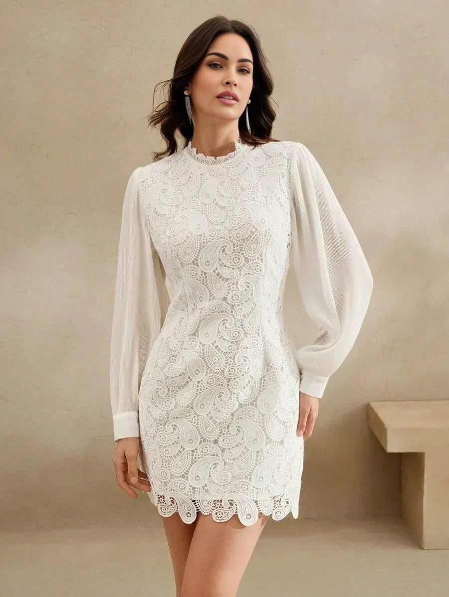 This elegant white dress features intricate lace detailing with a flattering fitted silhouette, accentuated by voluminous.