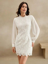 This elegant white dress features intricate lace detailing with a flattering fitted silhouette, accentuated by voluminous.