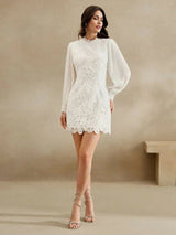 Elevate your style with this stunning white lace dress, featuring a fitted bodice and flowing long sleeves that add a touch.