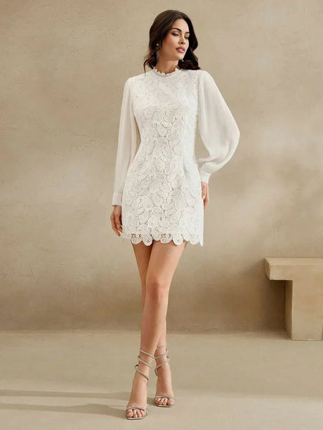 Elevate your style with this stunning white lace dress, featuring a fitted bodice and flowing long sleeves that add a touch.
