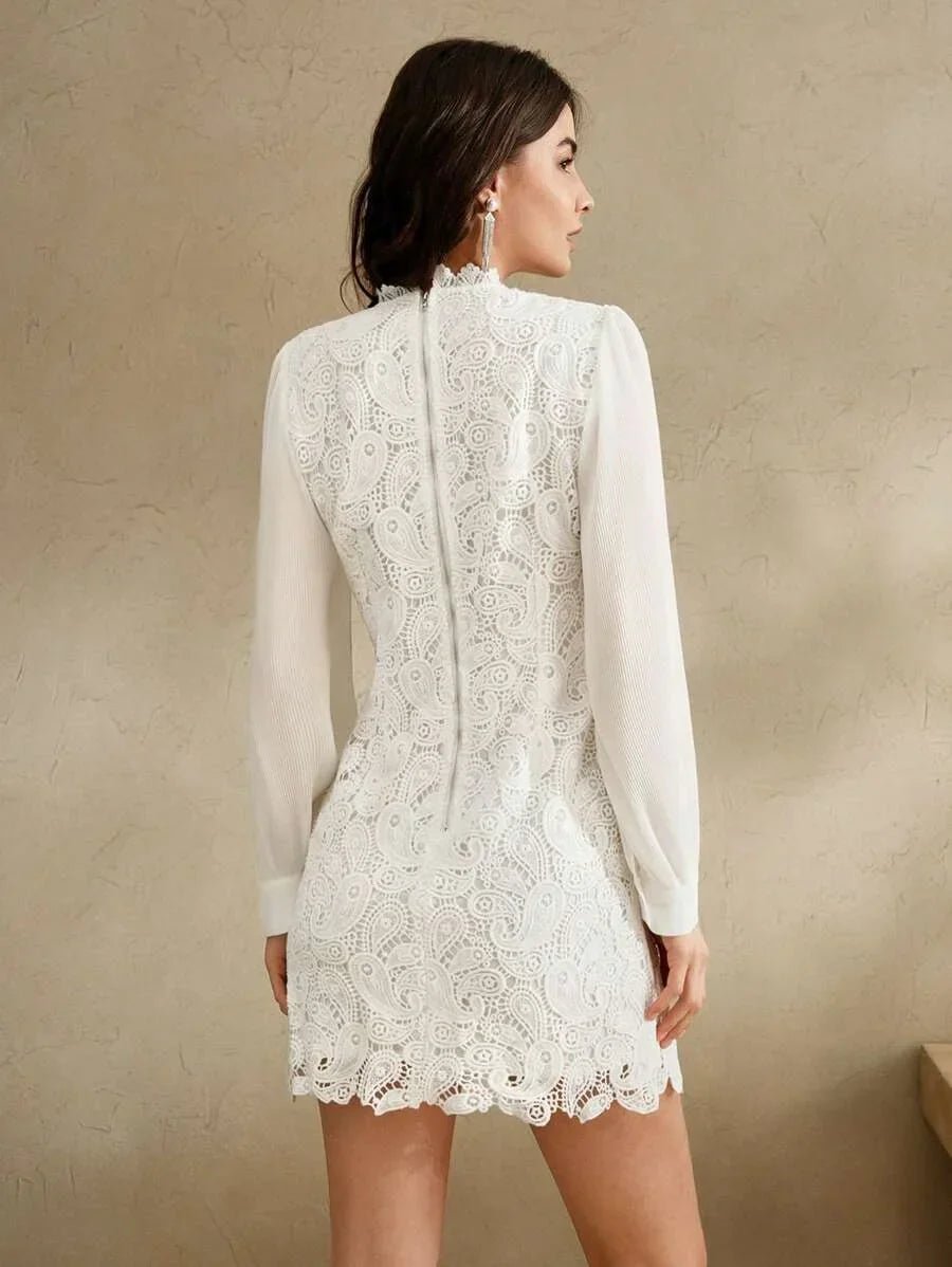 This elegant white dress features a delicate lace design with intricate paisley patterns, offering a chic and feminine.