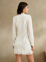This elegant white dress features a delicate lace design with intricate paisley patterns, offering a chic and feminine.